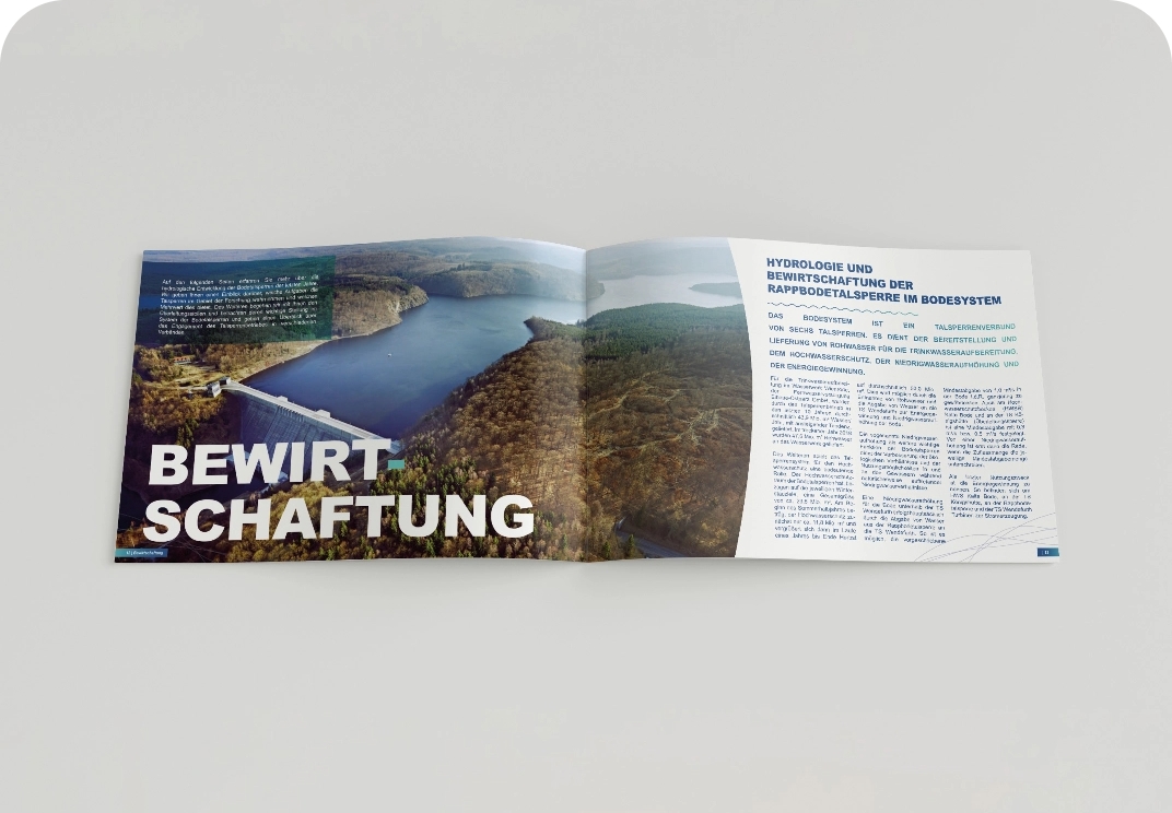 Aufgeschlagenes Magazin mit Bildern und Text zur Bewirtschaftung der Rappbode-Talsperre